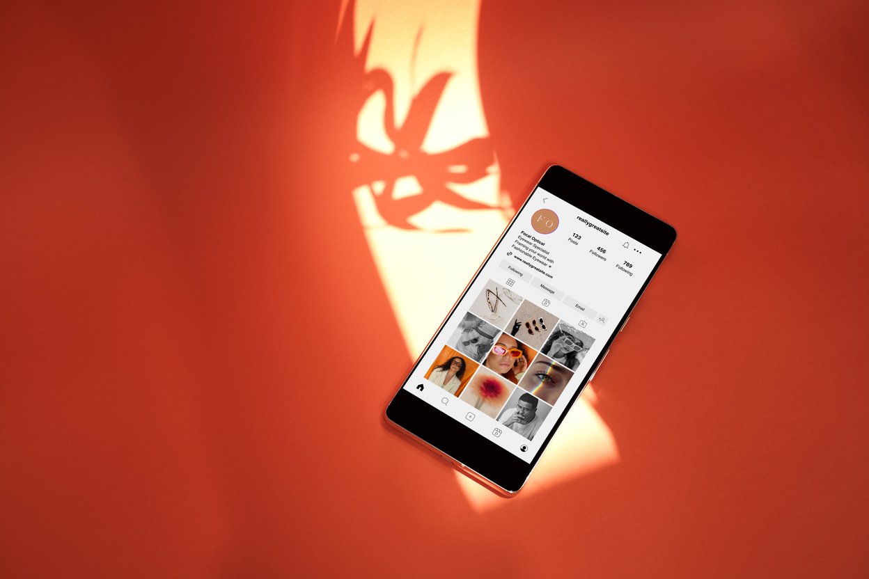 Social Media Mockup on Smartphone on Orange Background